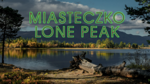Photo of a mountain in the distance with a lake in the foreground. Text overlay reads, "Miasteczko Lone Peak"